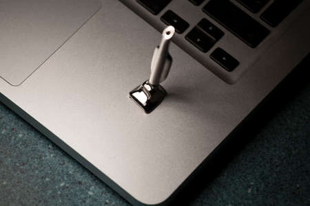iron mini vacuum cleaner laptop marble background nobody