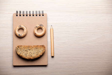 cookies notepad pencil wooden table nobodyの写真素材