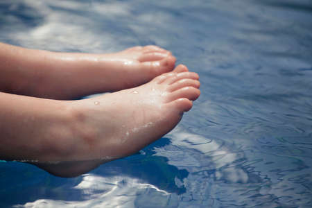 children foot swimming pool backgroundの写真素材
