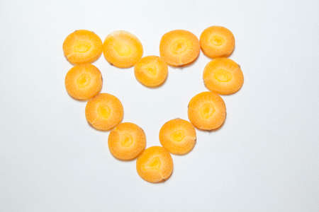 heart symbol carrot white backgroundの写真素材