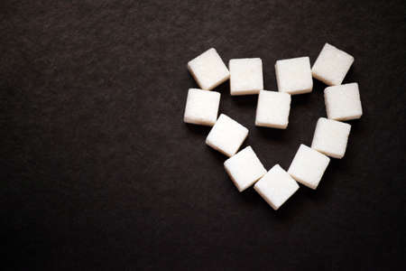 sugar heart symbol dark background