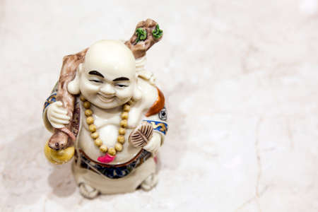 stone statue sharp wooden backgroundの写真素材