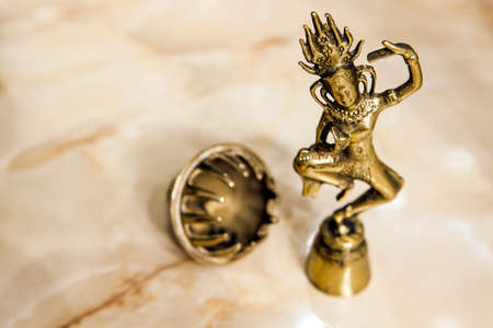 gold statue sharp marble backgroundの写真素材