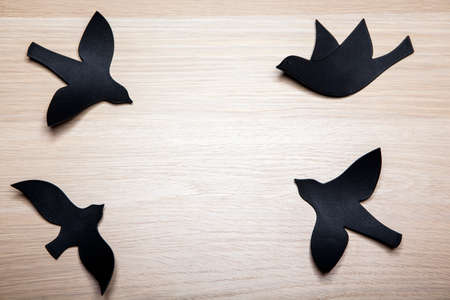 paper bird wooden table background