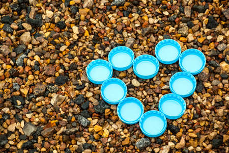 bottle cap natural stone backgroundの写真素材