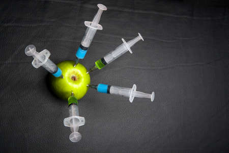 nitrate syringe apple leather backgroundの写真素材