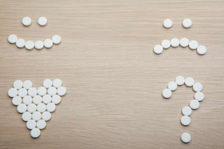 pill symbol wooden table background