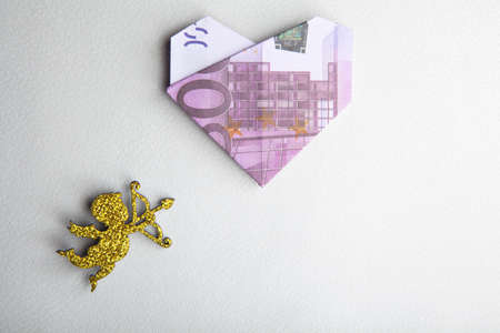 cupid money white leather backgroundの写真素材