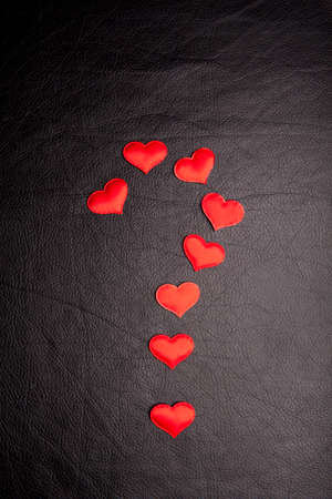 red heart dark leather background
