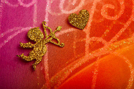gold cupid heart textile background