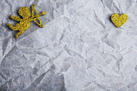 gold cupid heart paper background