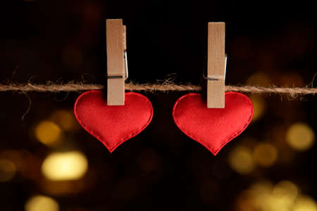 heart clothespin rope dark background