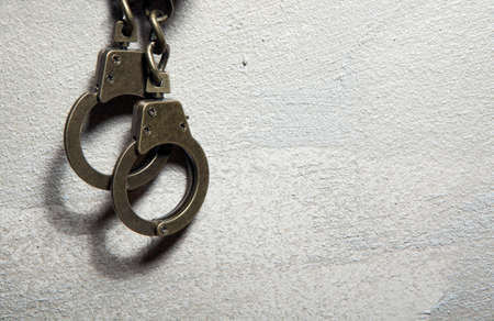 iron handcuffs sharp wall background