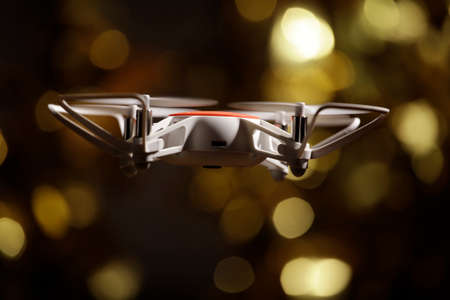 quadcopter gold bokeh dark background
