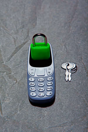 mobile phone lock key parchment paper background