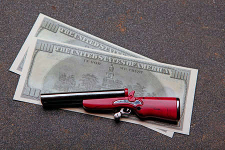image of money gun asphaltの写真素材