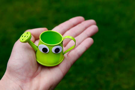 image of water can on handの写真素材