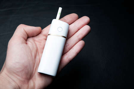image of electronic smoke device on handの写真素材
