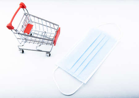 image of trolley and mask on white backgroundの写真素材
