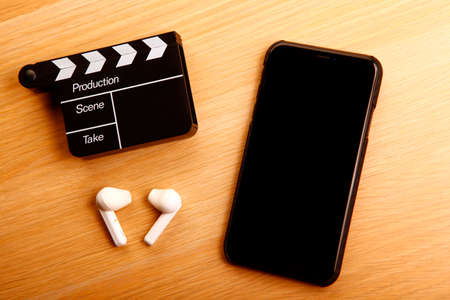 image of mobile phone clapper board headphoneの写真素材