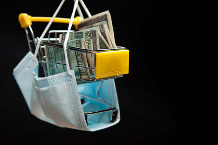 image of mask trolley money banknote dark background