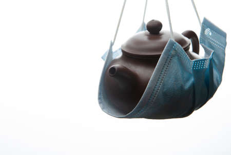 image of teapot mask white backgroundの写真素材