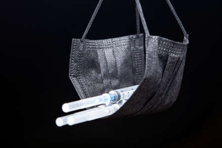 image of mask syringe dark backgroundの写真素材