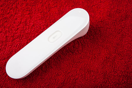 image of thermometer electronic red background