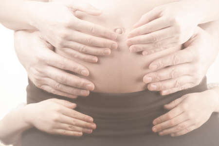 image of pregnant woman hand white backgroundの写真素材