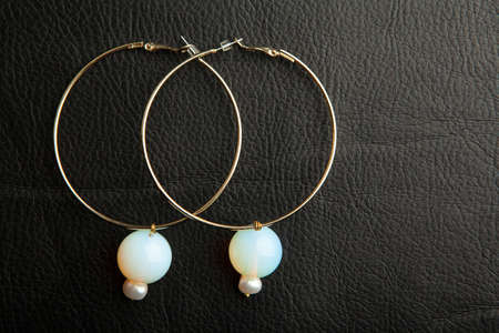 image of earrings leather backgroundの写真素材