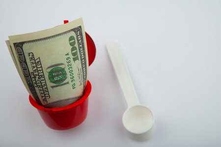 image of coffee capsule money white backgroundの写真素材