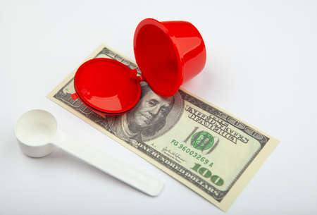 image of coffee capsule money white backgroundの写真素材