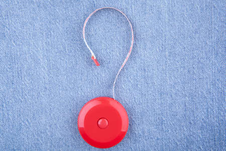 image of tape measure jeans background