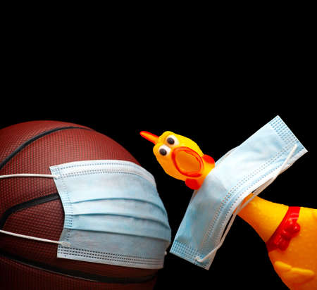 image of basketball mask rubber chicken dark backgroundの写真素材
