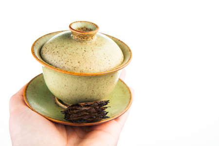 image of tea cup hand white backgroundの写真素材