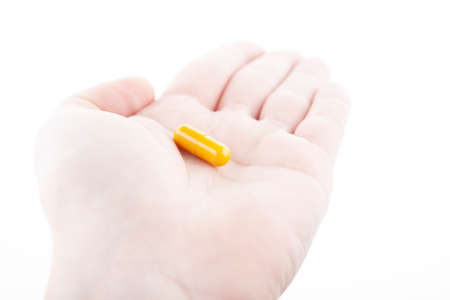 image of pill hand white backgroundの写真素材