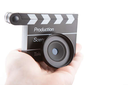 image of lens clapper board hand white backgroundの写真素材