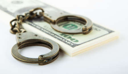 image of handcuffs money white background