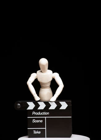 image of clapper board wooden figure dark backgroundの写真素材