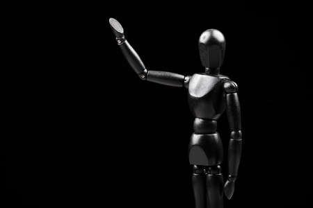 image of wooden mannequin dark background