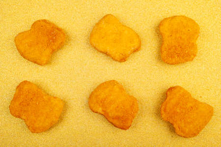 image of chicken nuggets golden backgroundの写真素材