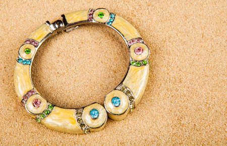 image of bracelet sand background