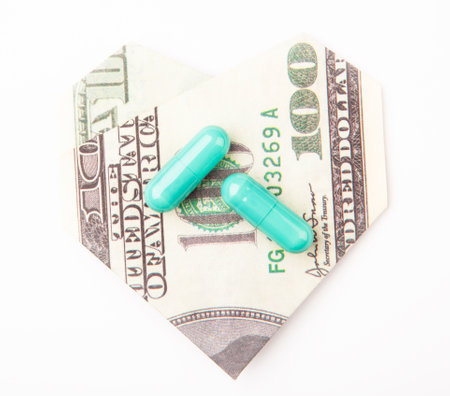 image of pills origami money heart symbol white background