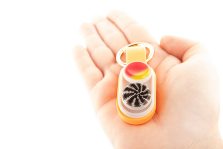 image of plastic toy hand white background