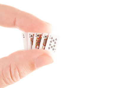 Playing cards in hand white backgroundの写真素材