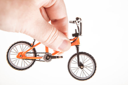 Close-up of a bicycle model in hand on a white background