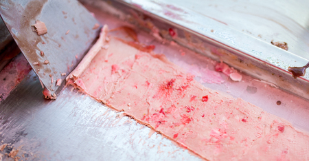 The process of making stir-fried ice cream rolls at freeze pan. Rolled ice cream, handmade  dessert...