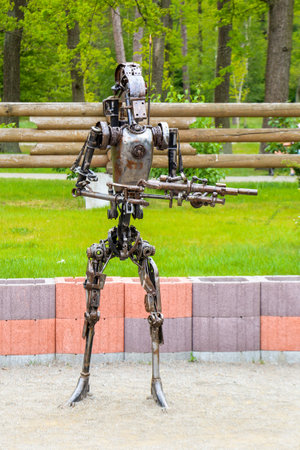 Star wars battle droid figure statue made of scrap metal and rusty gears. Central park, Bucha, Ukraine, 21st of May, 2017のeditorial素材