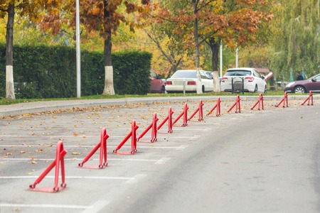 Empty car parking. Outdoor parking place with mechanical barrier lock.  Reserved parking lot....