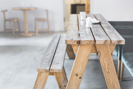 Wooden bench and table indoor. Rural rustic interior. Empty country cafe or dining room interiorの写真素材